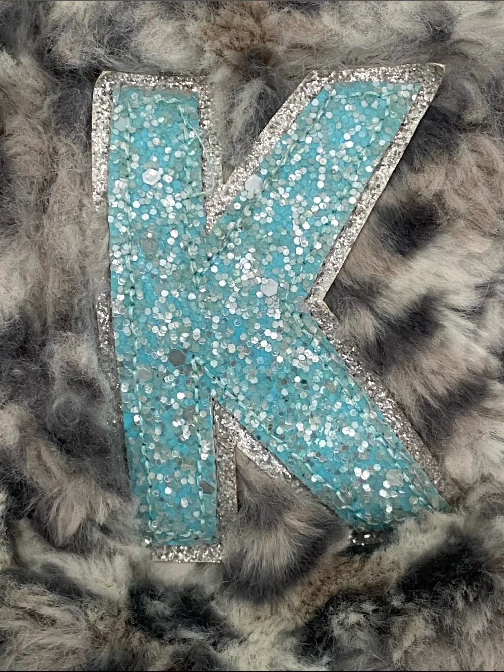 Justice Faux Fur Animal Ear Hat with Aqua Lining and Glitter 'K'